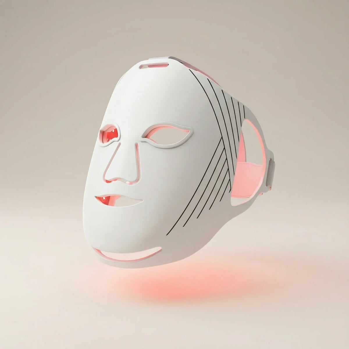 White Nicebeam LED face mask illuminated with red light on a neutral background
