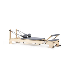Elina Pilates Lignum wooden reformer in grey, angled view