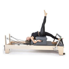 Pilates exercise performed on the grey Elina Pilates Elite Reformer