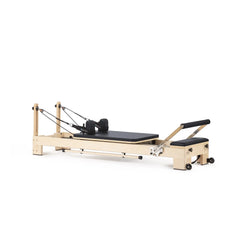 Elina Pilates Lignum wooden reformer in black, angled view