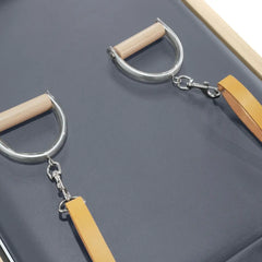 Elina Pilates Natural Wood Cadillac Reformer leather strap and wooden handle detail
