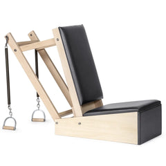 Elina Pilates Baby Chair in black shown from the side with spring handles