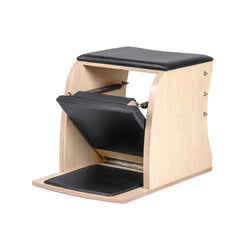 Elina Pilates Classic Wunda Chair in black shown from the side with padded pedal