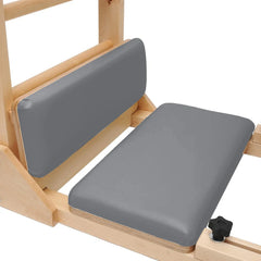 Close-up of padded foot platforms on the gray Elite Elina Pilates wooden base Ladder Barrel