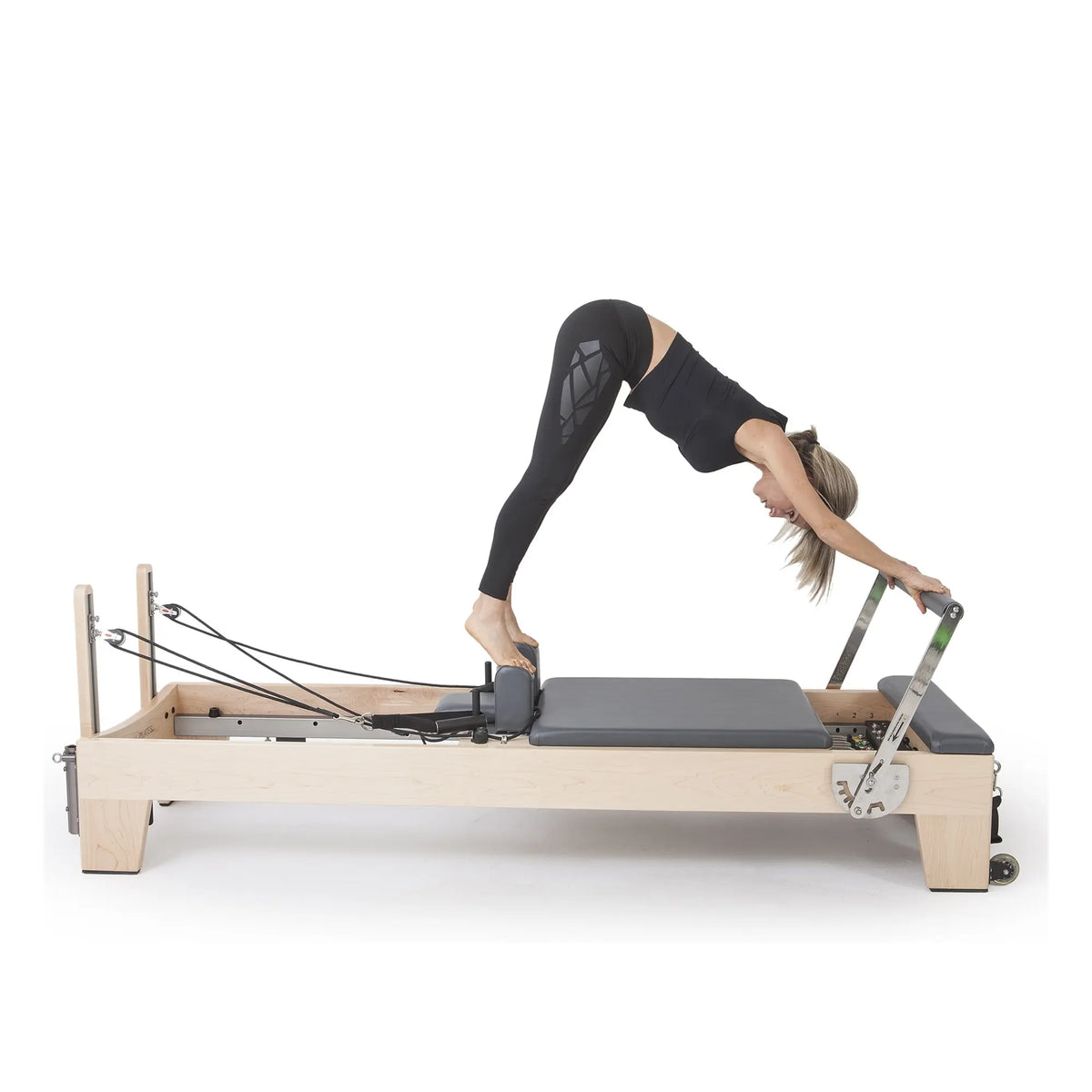 Standing Pilates exercise on the grey Elina Pilates Elite Reformer