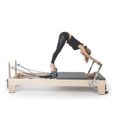 Standing Pilates exercise on the grey Elina Pilates Elite Reformer
