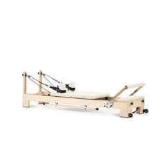 Elina Pilates Lignum wooden reformer in ivory, angled view