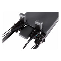 Close-up of the carriage and shoulder rests on the Elina Pilates Domo Reformer
