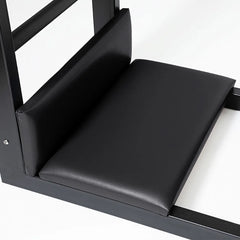 Close-up of padded foot platforms on the black Elite Elina Pilates steel base Ladder Barrel