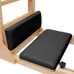 Close-up of padded foot platforms on the black Elite Elina Pilates wooden base Ladder Barrel