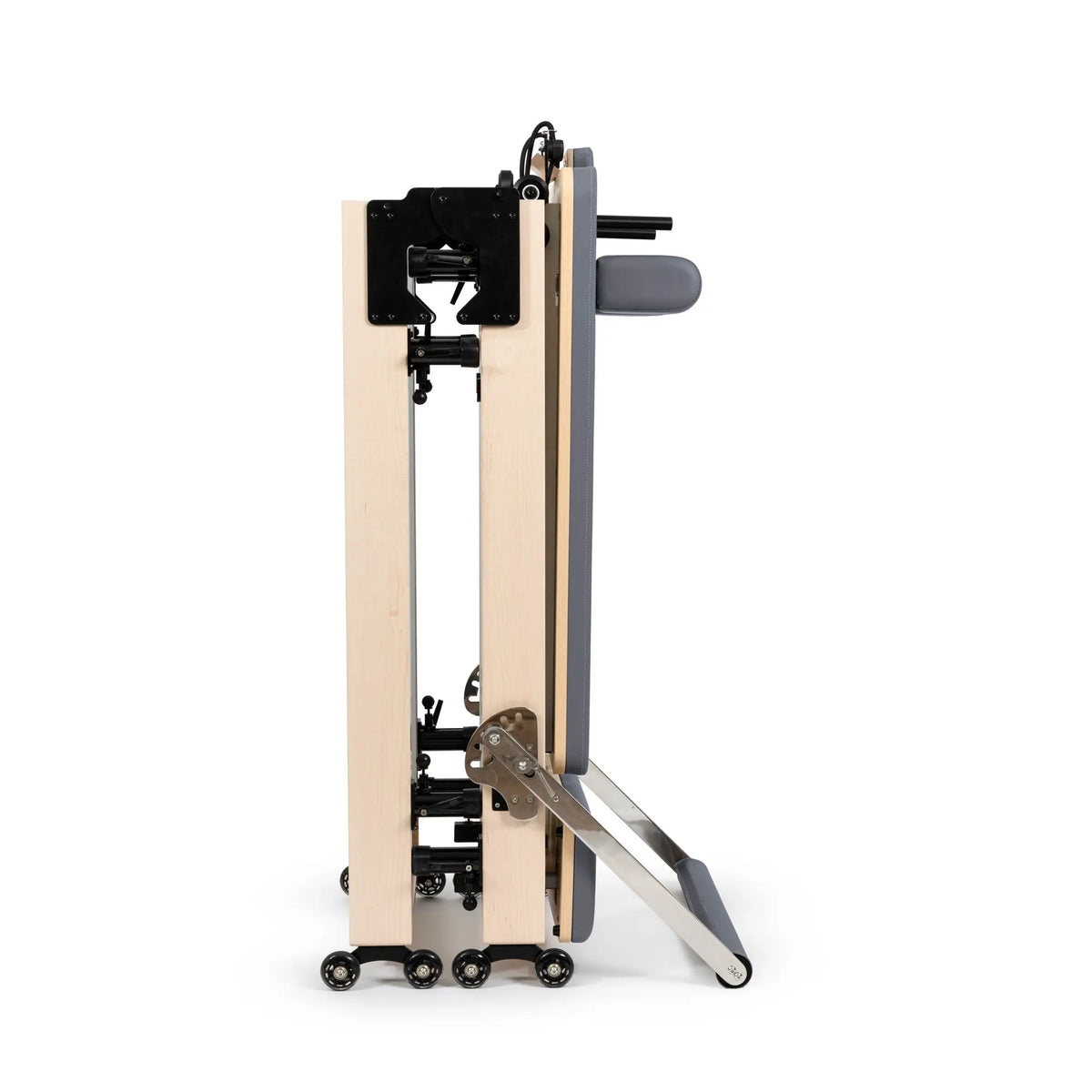 Elina Pilates Fold Reformer folded upright for compact home storage