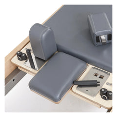 Padded accessories and adjustment controls on the grey Elina Pilates Elite Reformer