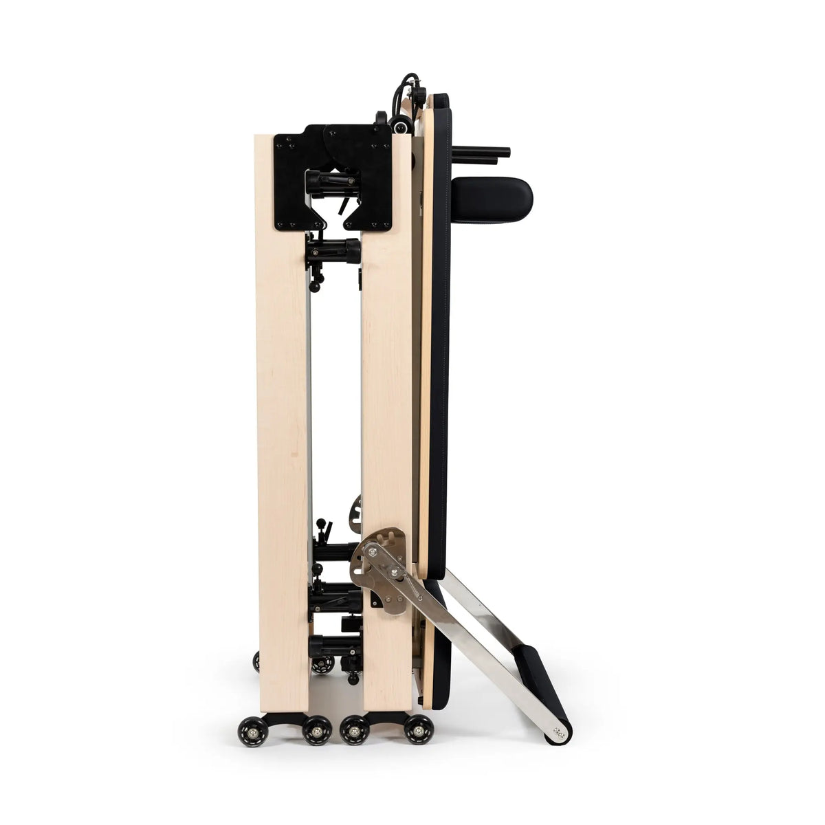 Side view of the Elina Pilates Fold Reformer in its folded storage position