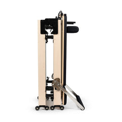 Side view of the Elina Pilates Fold Reformer in its folded storage position