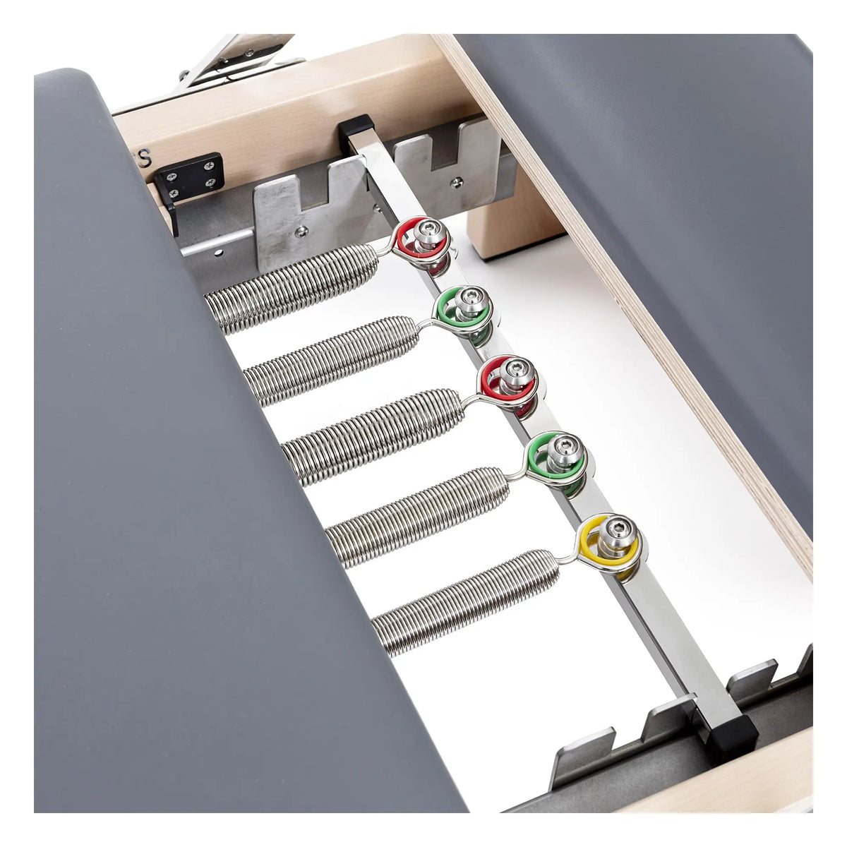 Color-coded spring system on the grey Elina Pilates Lignum Reformer with Tower
