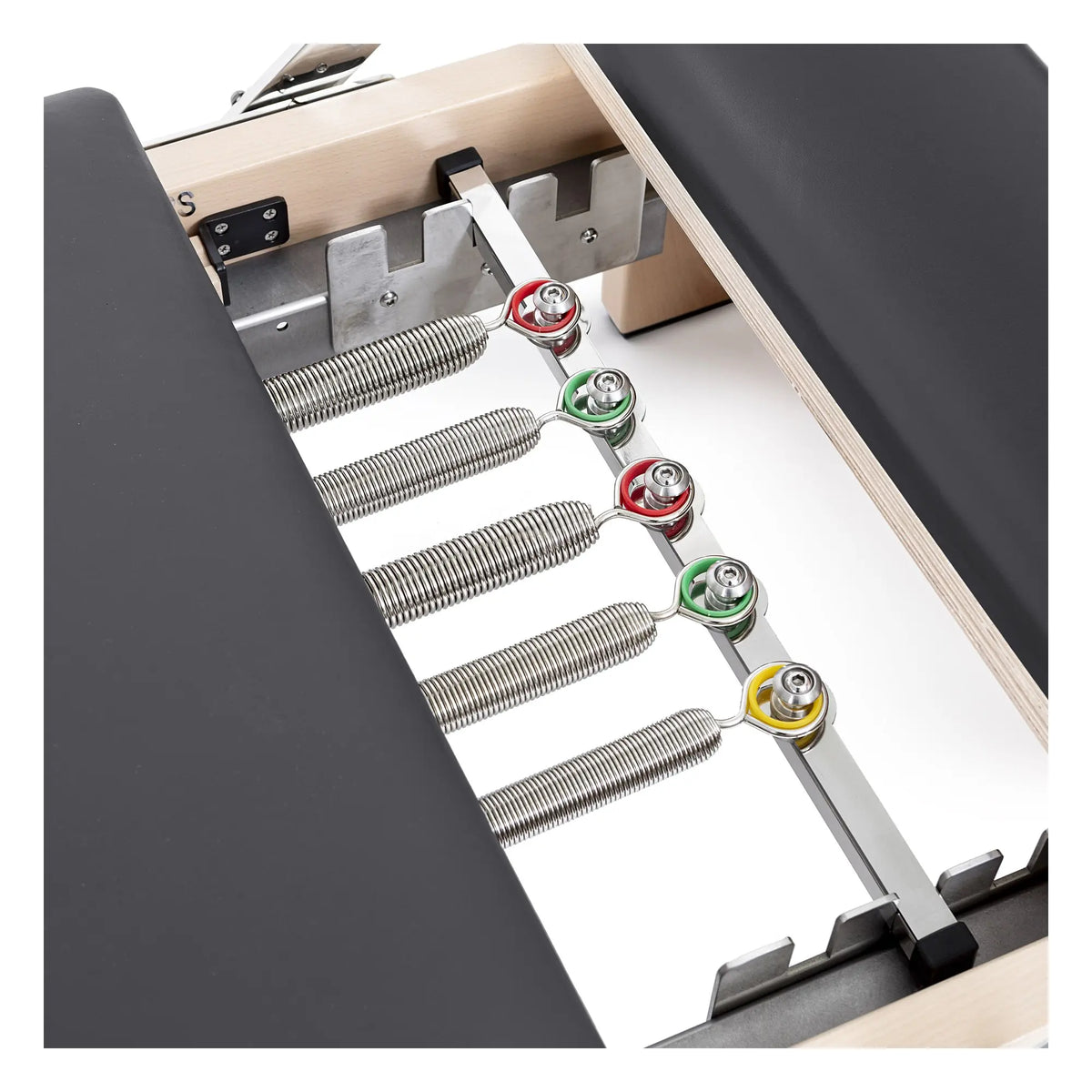 Color-coded spring system on the black Elina Pilates Lignum Reformer with Tower