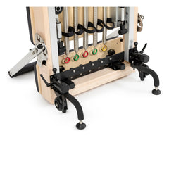 Close-up of the transport wheels on the black Elina Pilates Vertical Reformer