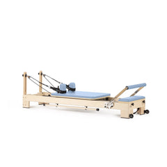 Elina Pilates Lignum wooden reformer in Ocean Blue, angled view
