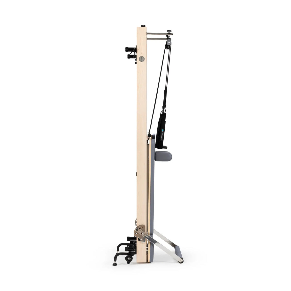 Grey Elina Pilates Vertical Reformer stored upright between workouts