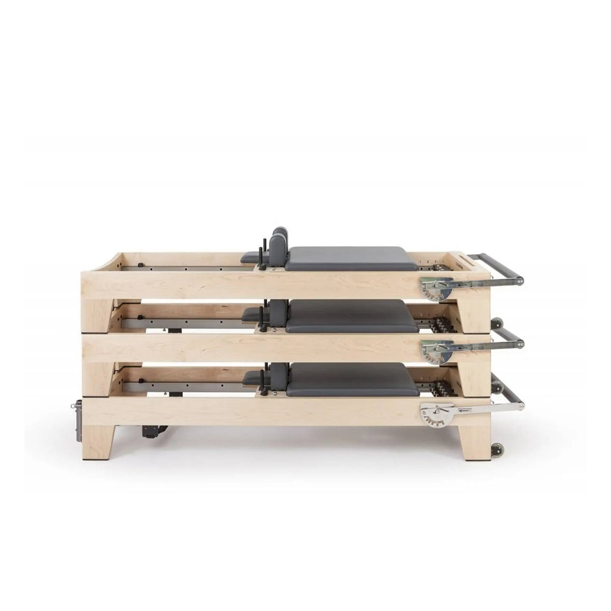 Three grey Elina Pilates Elite Reformers stacked for studio storage