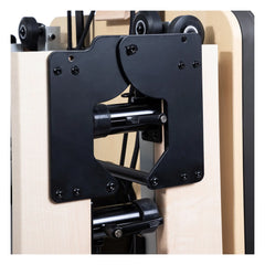 Close-up of the folding mechanism on the Elina Pilates Fold Reformer