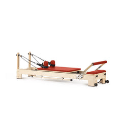 Elina Pilates Lignum wooden reformer in red, angled view