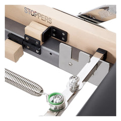 Close-up of the stopper system on the black Elina Pilates Lignum Reformer with Tower