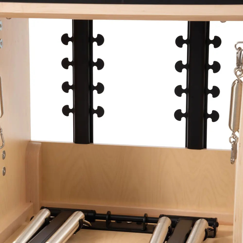 Close view of the spring anchoring positions on the Elina Pilates wooden Combo Chair