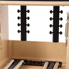 Close view of the spring anchoring positions on the Elina Pilates wooden Combo Chair