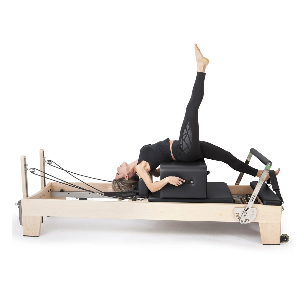 Pilates exercise performed on the black Elina Pilates Elite Reformer