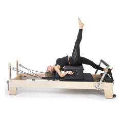 Pilates exercise performed on the black Elina Pilates Elite Reformer