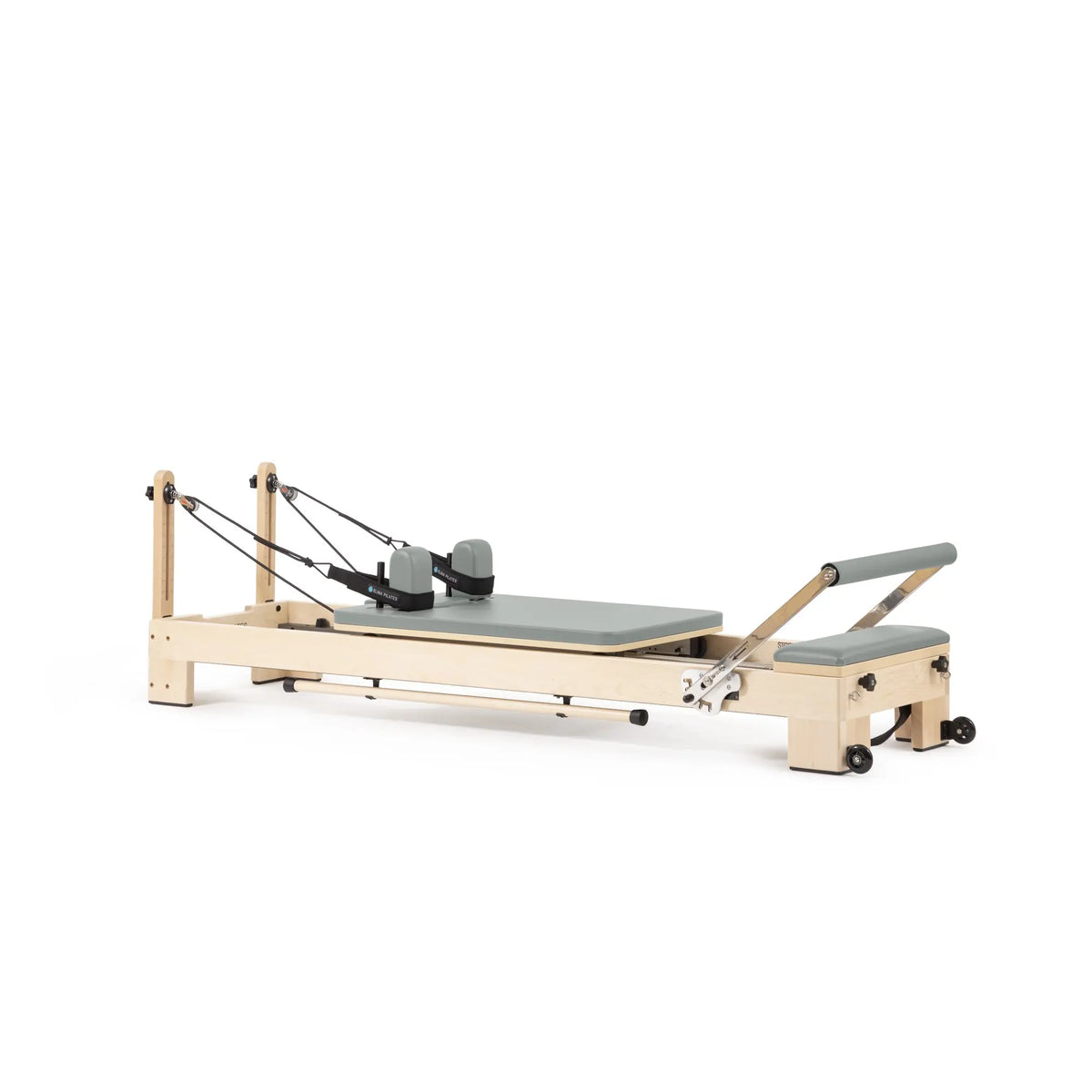 Custom-color Elina Pilates Lignum wooden reformer in Eucalyptus Green, angled view
