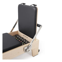 Close-up of the upholstery and adjustment system on the black Elina Pilates Elite Reformer