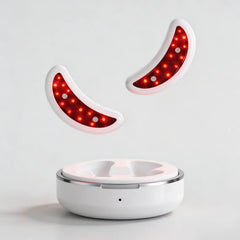 Two glowing Nicebeam Red Light Therapy Eye Pods above their round charging case