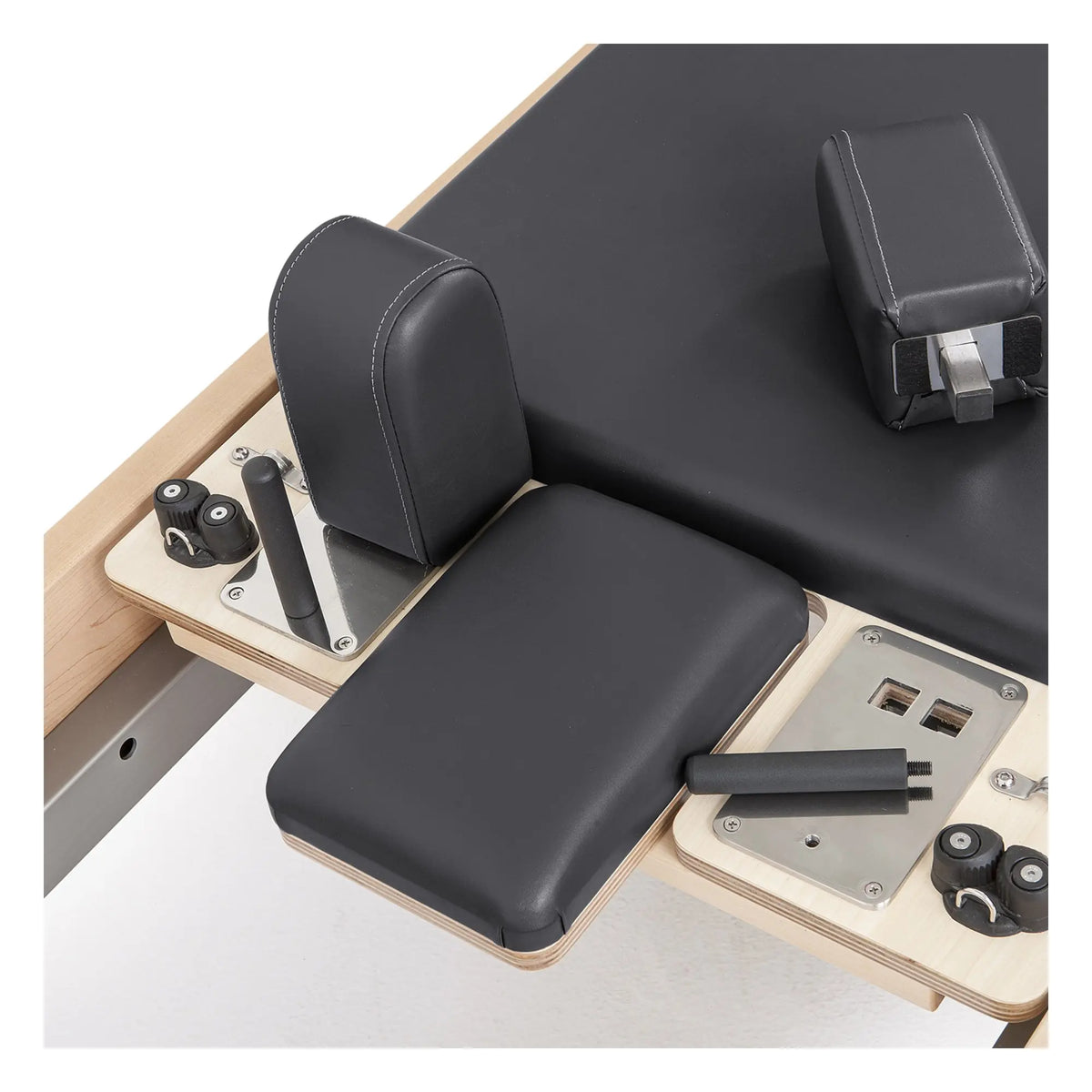 Padded accessories and adjustment controls on the black Elina Pilates Elite Reformer