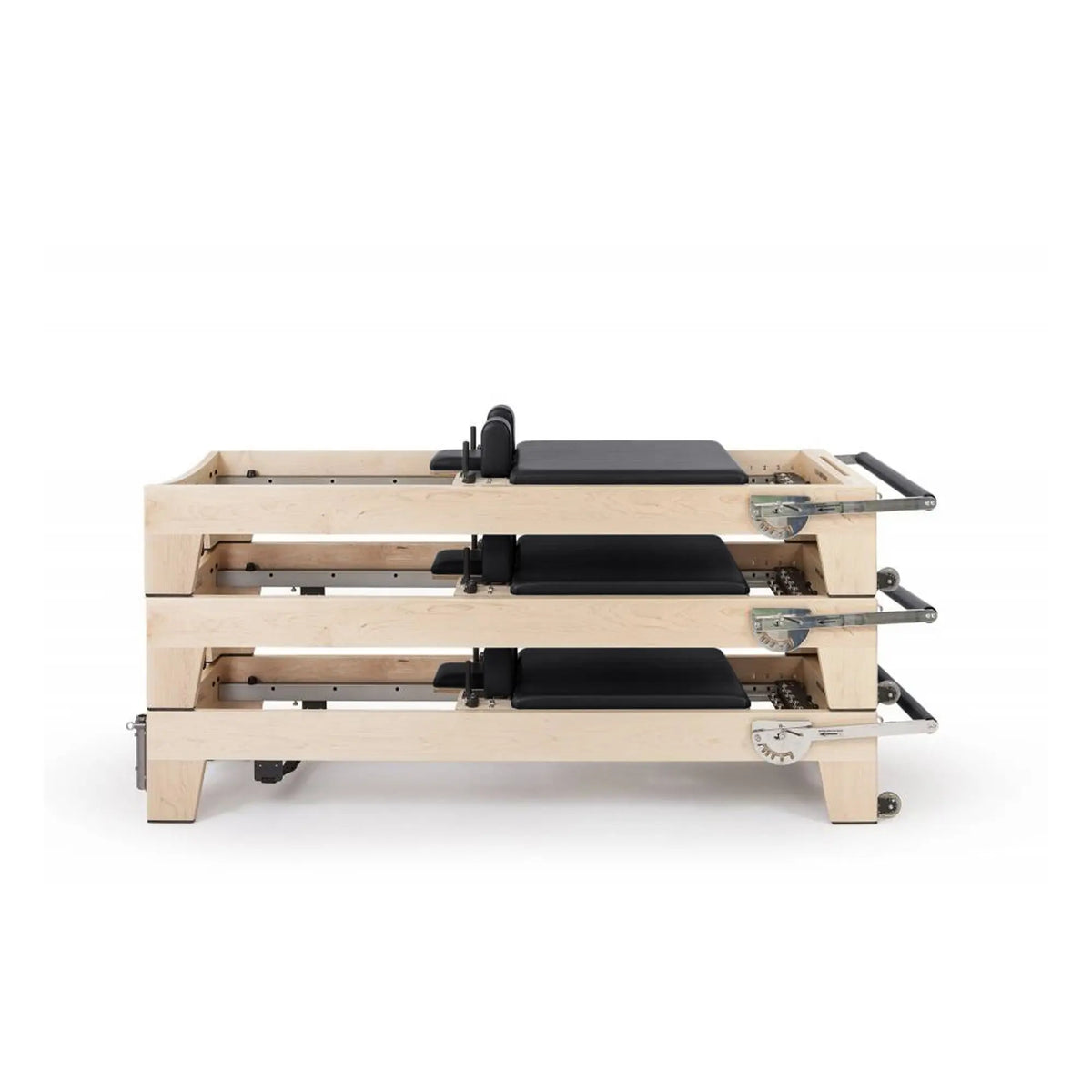 Three black Elina Pilates Elite Reformers stacked for studio storage