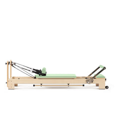 Elina Pilates Lignum wooden reformer in green, full side view