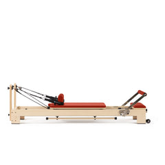 Elina Pilates Lignum wooden reformer in red, full side view