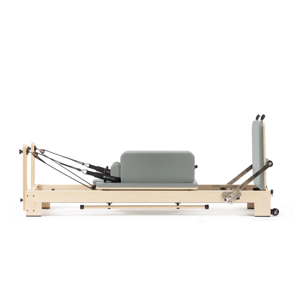 Custom-color Elina Pilates Lignum wooden reformer in Eucalyptus Green with sitting box