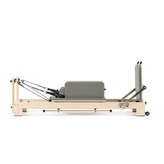 Custom-color Elina Pilates Lignum wooden reformer in Iceberg Green with sitting box