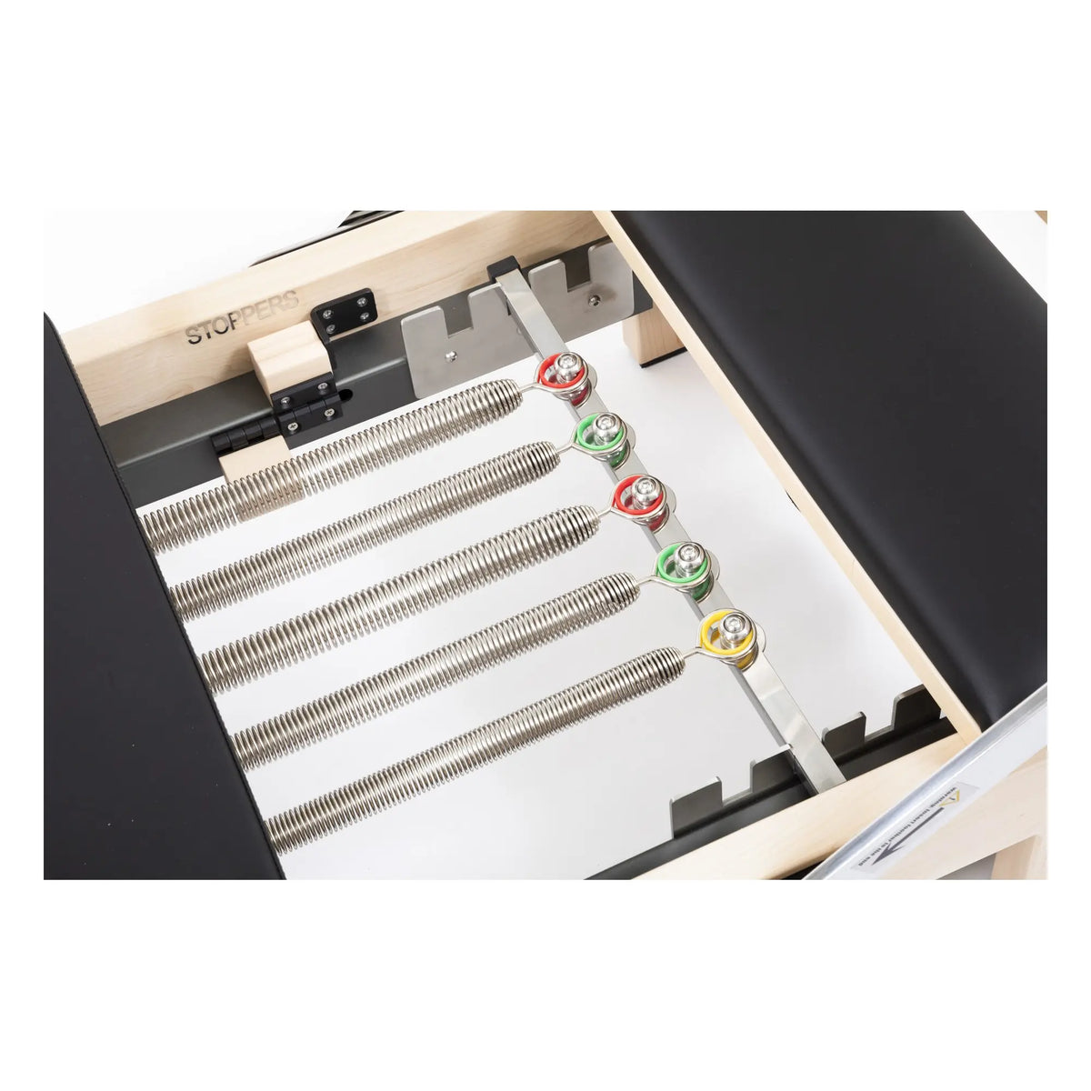 Color-coded spring system on the Elina Pilates Lignum Reformer