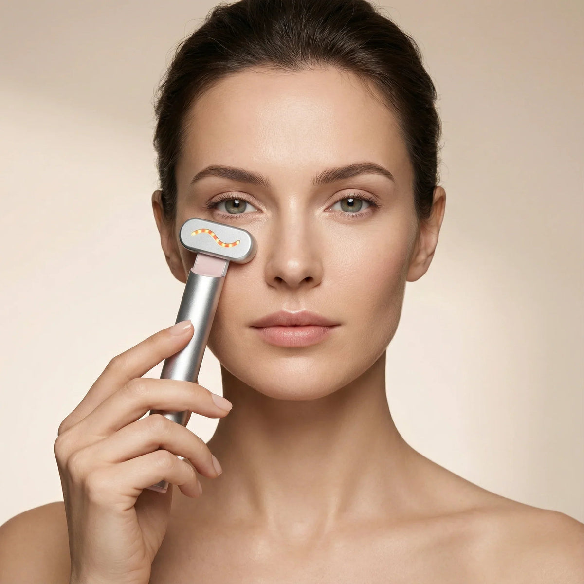 Woman using the Nicebeam 4-in-1 Skincare Wand on her lower cheek