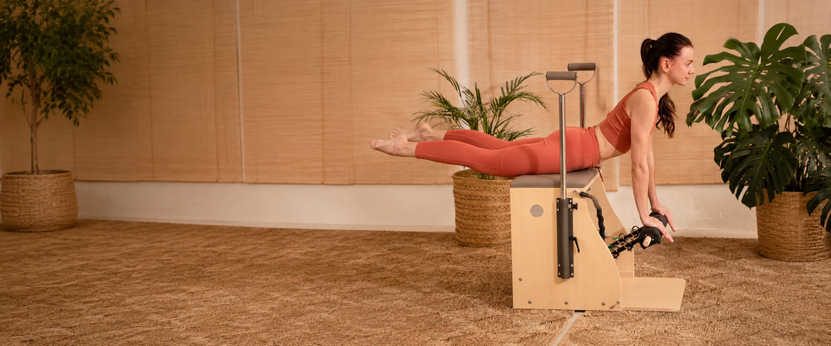 Woman training on an Elina Pilates chair
