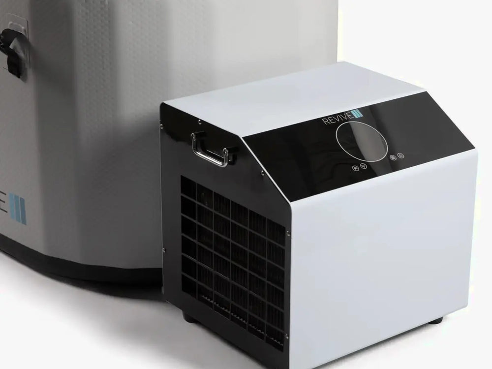 Close view of a Revive cold plunge chiller beside an inflatable tub.