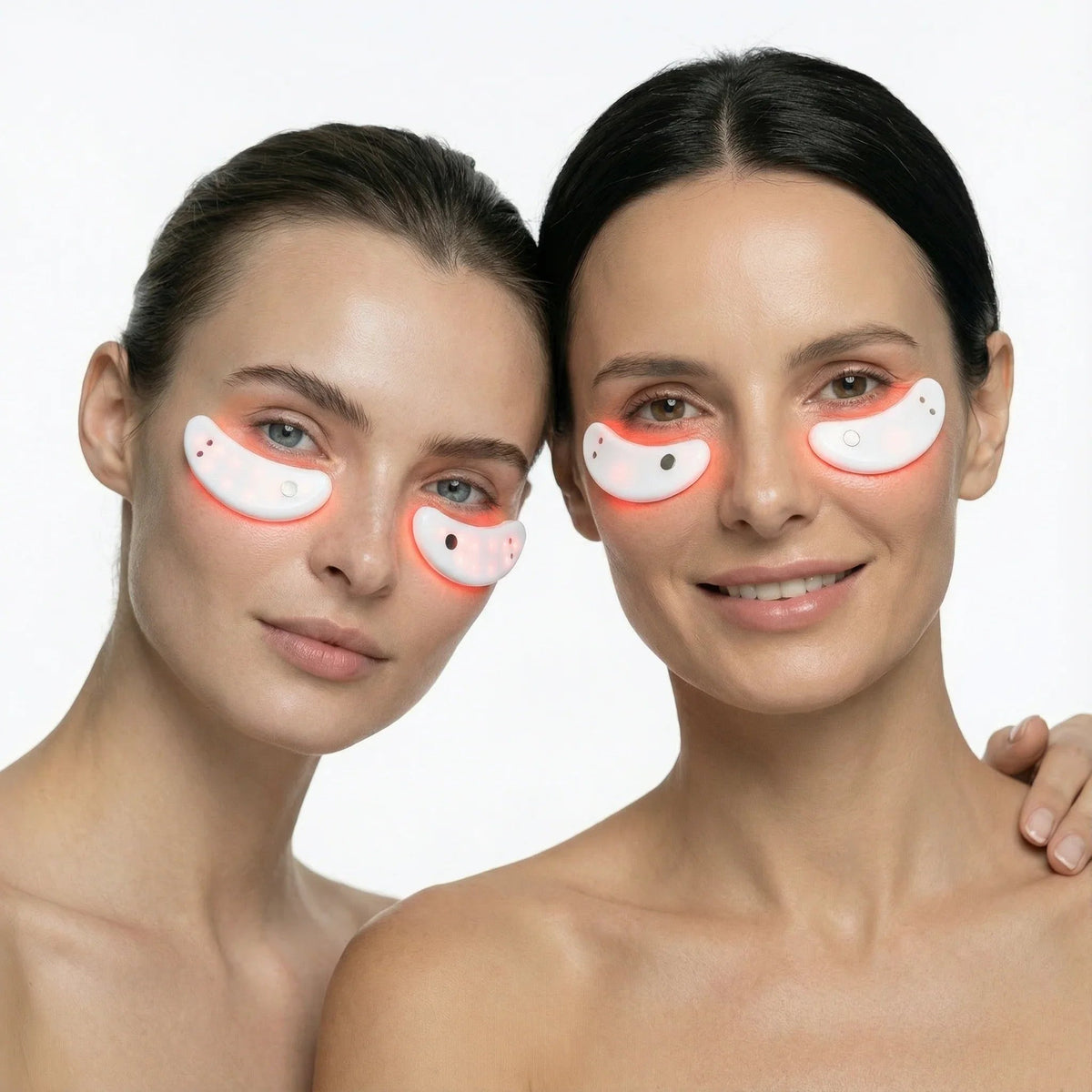 Two women wearing the Nicebeam red light eye mask pods beneath their eyes