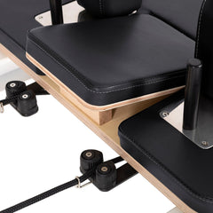 Black upholstery and rope adjustment hardware on the Nubium reformer
