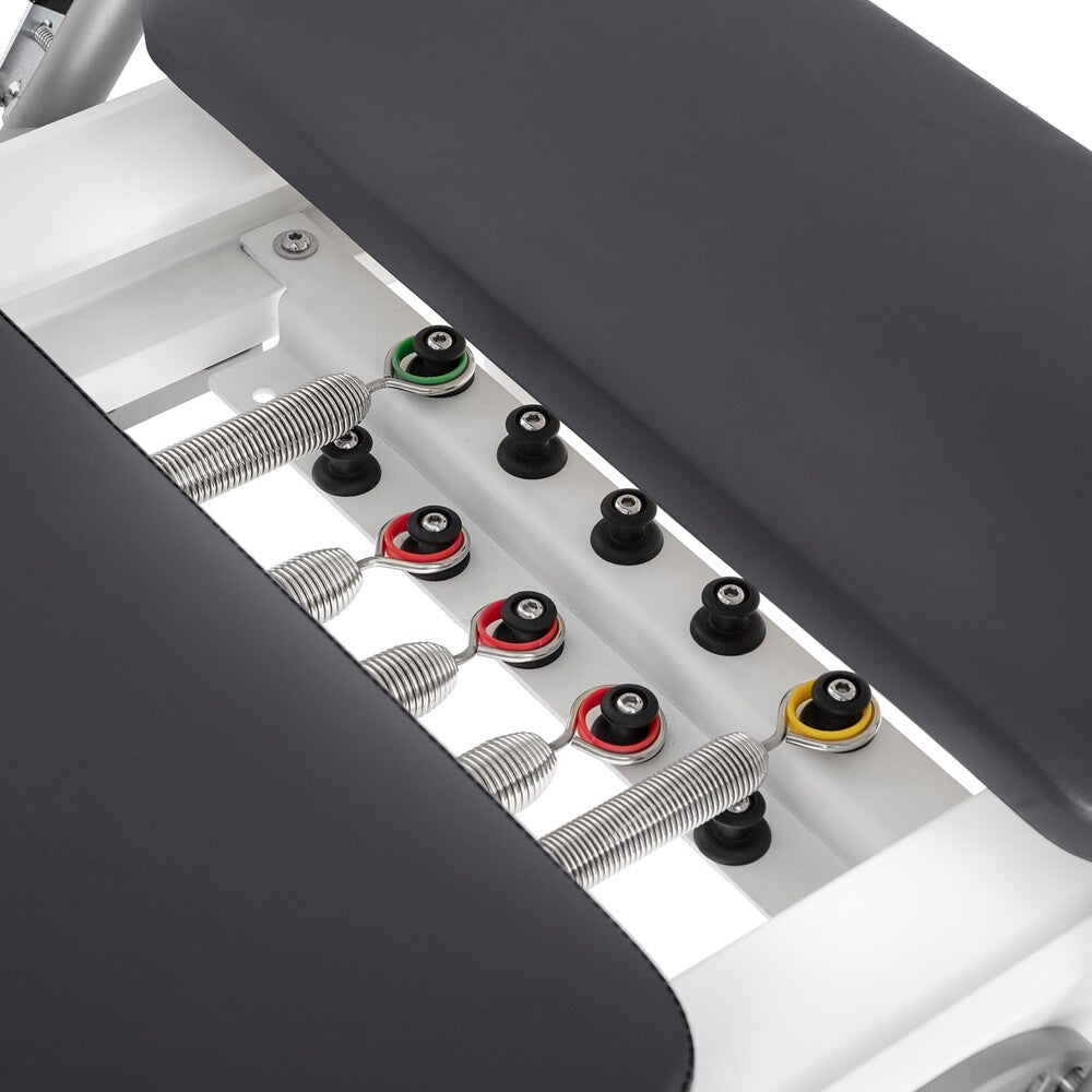 Nubium reformer resistance system with five springs and black upholstery