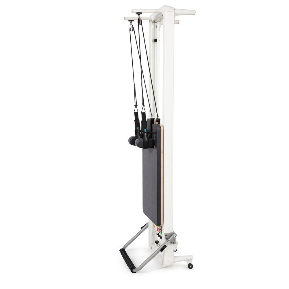 Elina Pilates Nubium reformer with black upholstery stored vertically