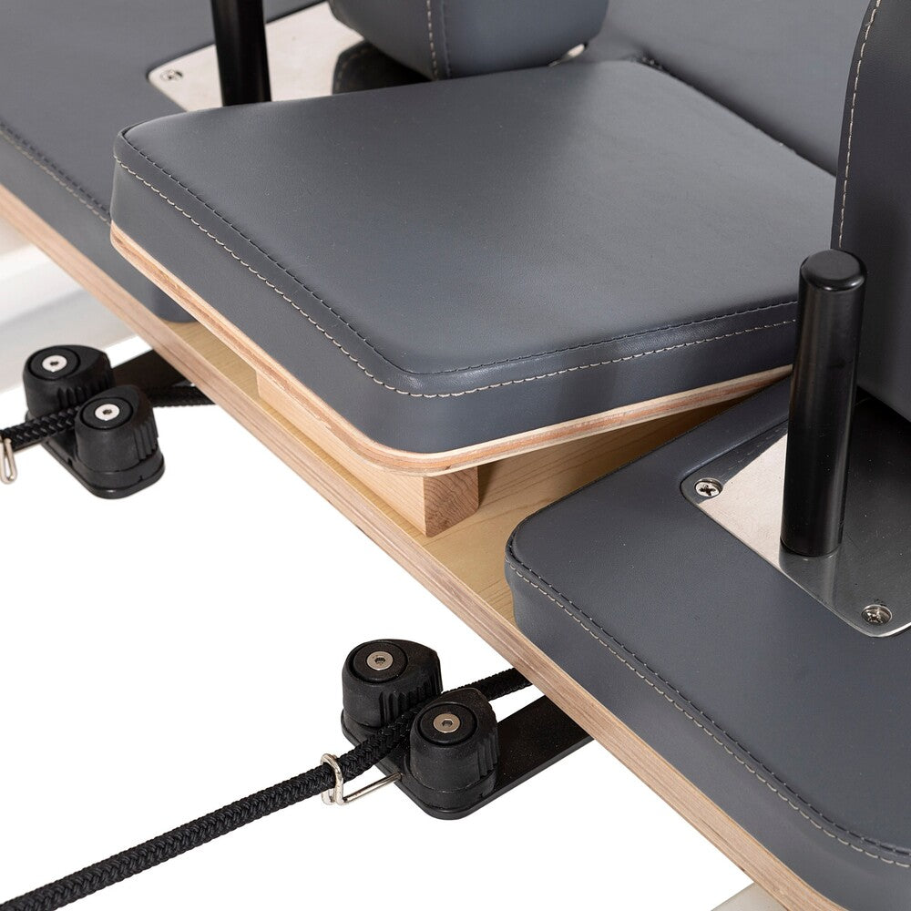 Gray upholstery and rope adjustment hardware on the Nubium reformer