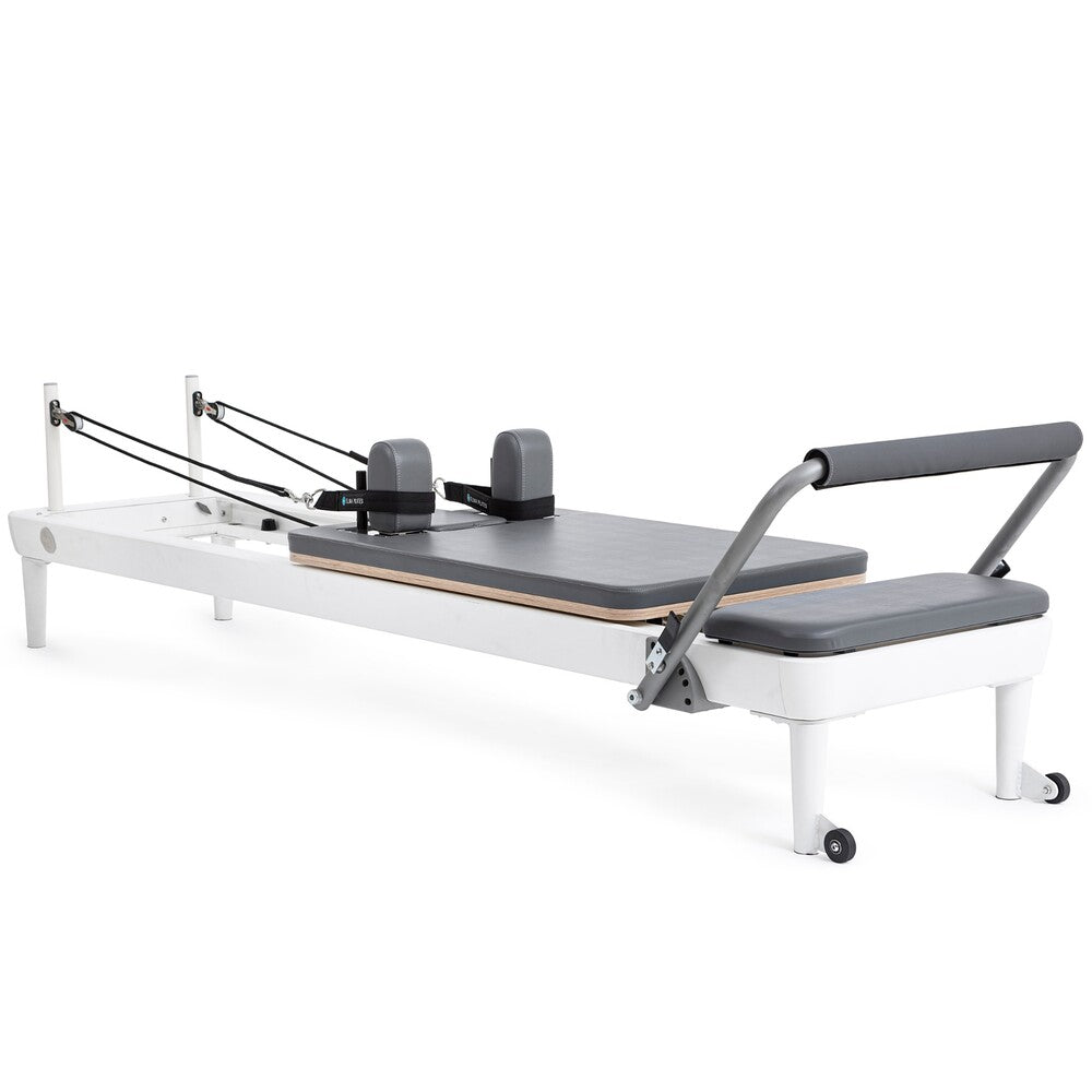 Elina Pilates Nubium aluminum reformer with gray upholstery, angled view